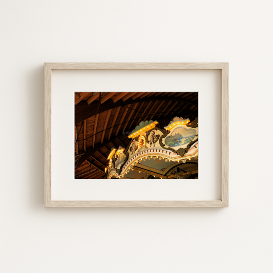 Photograph showing the details of Paragon Carousel in Hull, Massachusetts framed on a wall