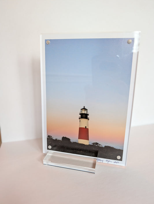 Acrylic block photo print on bookshelf with coastal New England photography